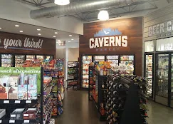 Sales floor and cooler run under the Caverns sign. Caverns Market, Salem, VA