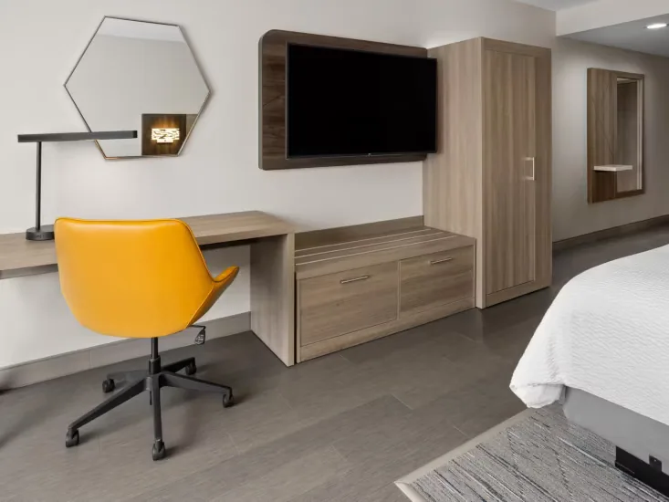 Guestroom work desk and storage wall. Holiday Inn Express & Suites, Waynesboro, VA