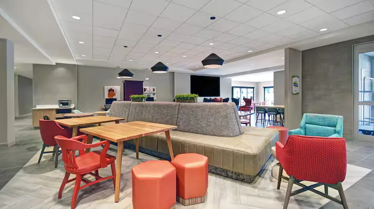 Lobby lounge and communal tables. Home2 Suites by Hilton, Blacksburg, VA