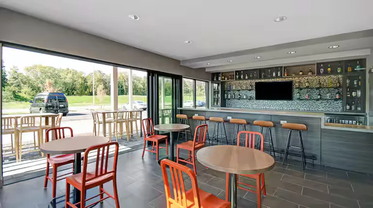 Outdoor grilling patio and bar seating. Home2 Suites by Hilton, Blacksburg, VA