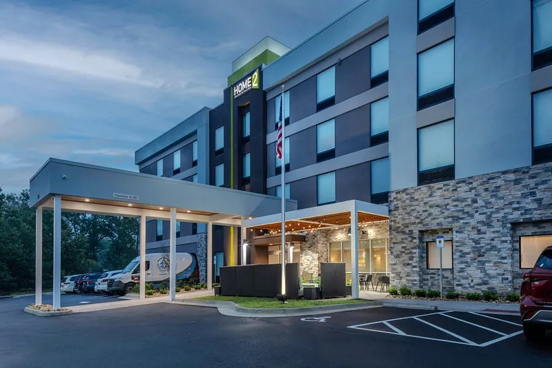 Porte-cochere and exterior at dusk. Home2 Suites by Hilton, Lynchburg, VA