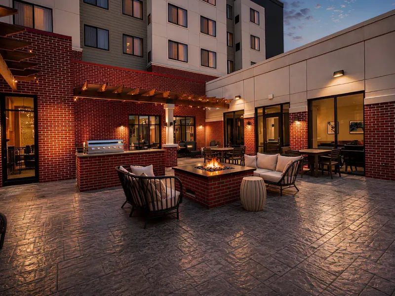 Outdoor terrace with fire pit at dusk. Residence Inn by Marriott, Lexington, VA