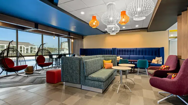 Lobby lounge with hanging chairs. Tru by Hilton, Christiansburg, VA
