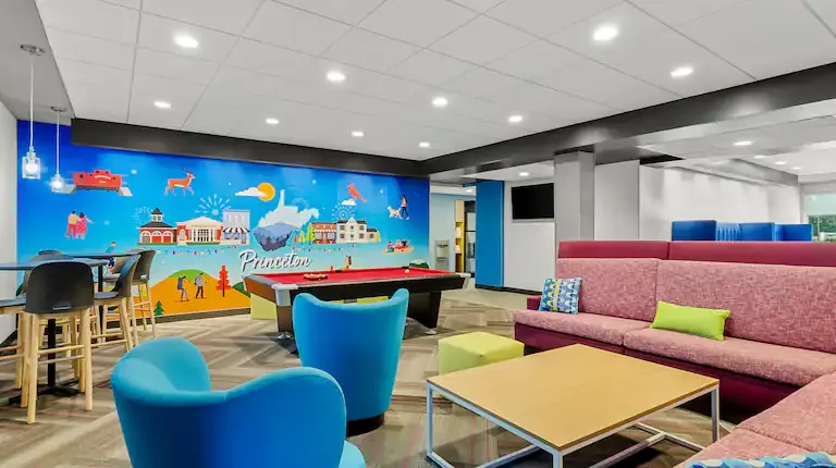 Game area with pool table and mural. Tru by Hilton, Princeton, WV
